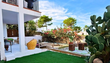 Resa Estates Ibiza Cala Tarida first line 3 bedrooms garden grass.jpg